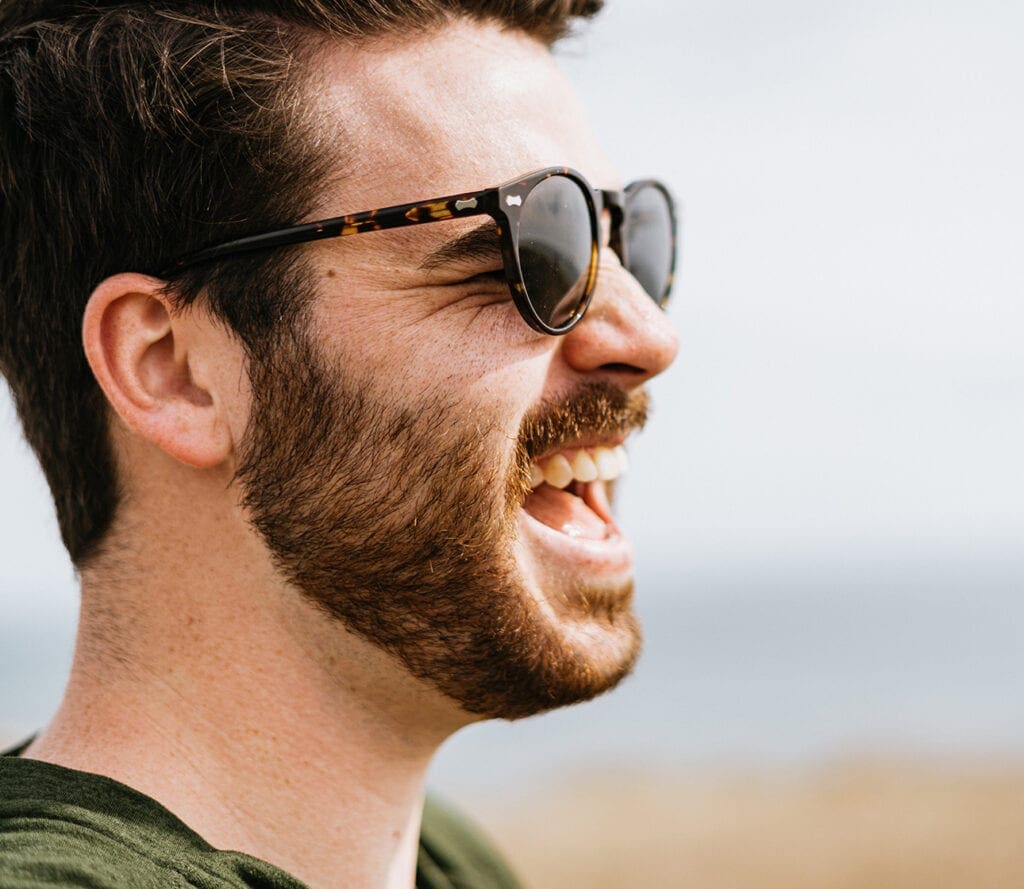 man-smiling-with-sunglasses