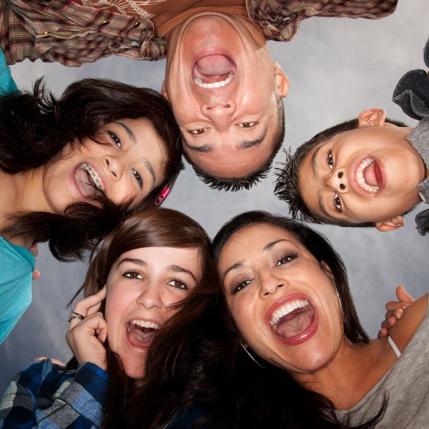 Looking up a a group of smiling people